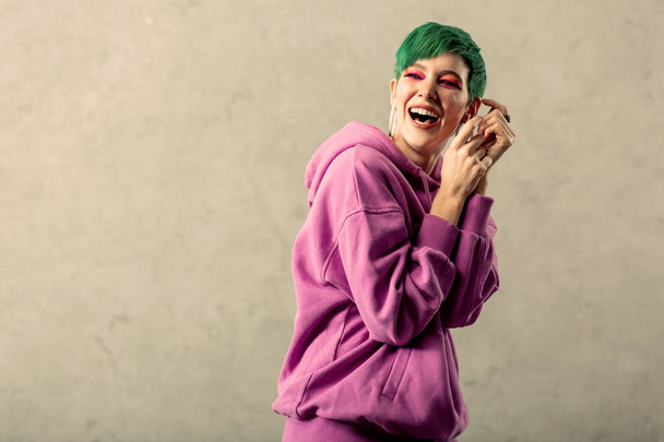 Beautiful green haired woman being very positive - 写真・画像