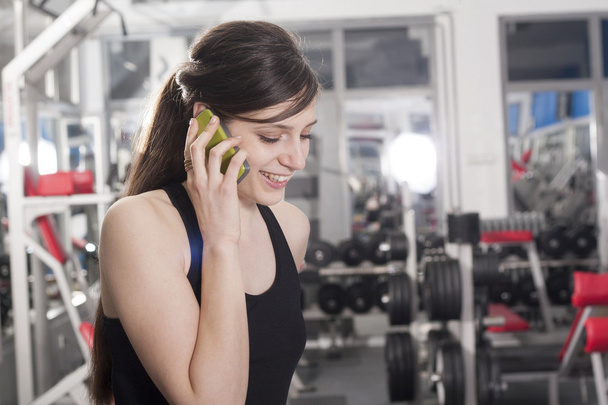 mobile phone in gym - Foto, Imagen