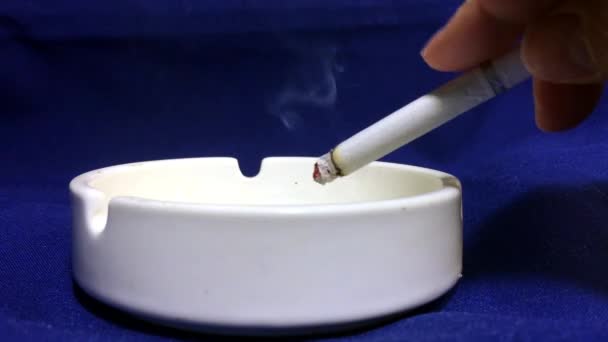 Cigarette are Smoking in the ashtray. The dangers of nicotine and tobacco.  - Video