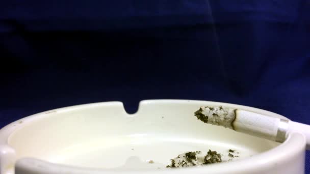 Cigarette are Smoking in the ashtray. The dangers of nicotine and tobacco.  - Footage, Video