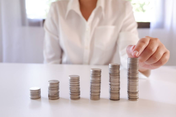 Business Person Placing Coin Over The Increasing Coins Stack. - Photo, image