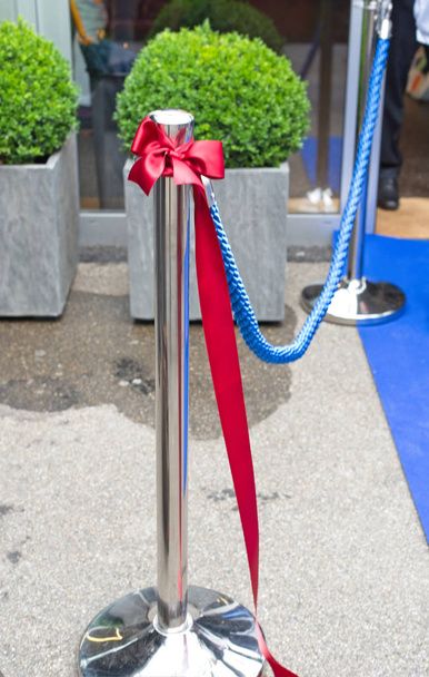 Opening events stand with blue rope and red ribbon.Close up - Photo, Image