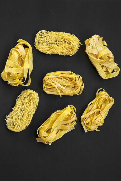 Set of various uncooked pasta(fettuccine, pappardelle, tagliolin - Fotó, kép