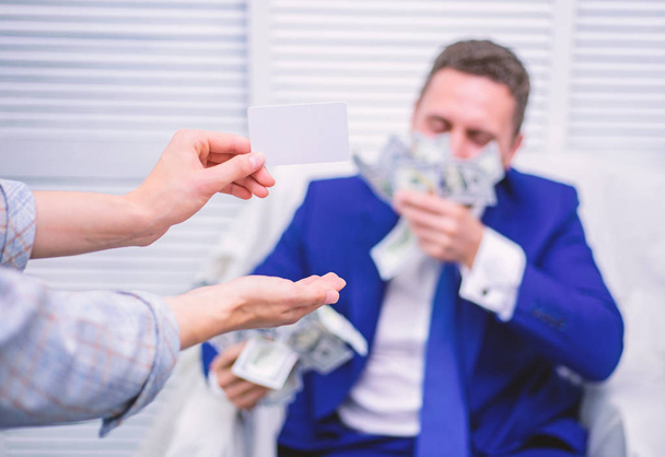 Excited successful businessman opened a box with money and rejoices in profits. Man cash money. Business, people and finances concept. - Photo, image