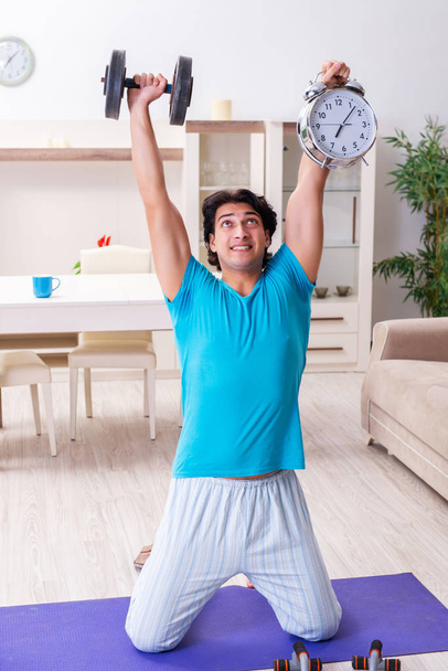 Young handsome man doing morning exercises  - Foto, imagen