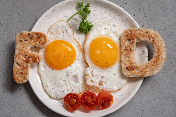 Word food written with toast letters eggs - 写真・画像
