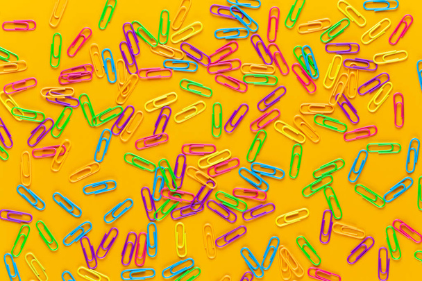 Paper color clip notebook on yellow background. Flat lay.  - Foto, immagini