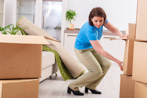 Middle-aged woman moving to new flat  - Photo, Image