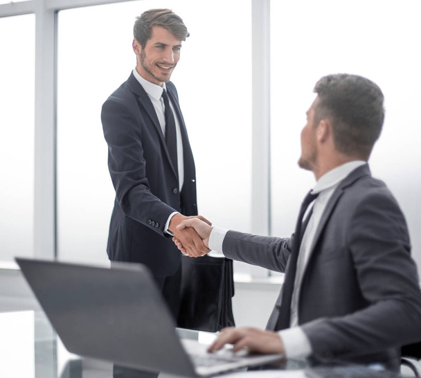 Two businessmen shake hands - Φωτογραφία, εικόνα
