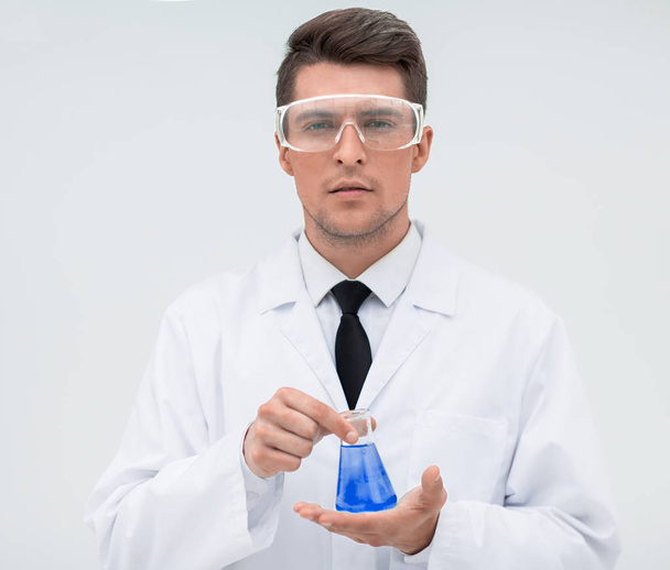 young scientist with a test tube - Fotó, kép