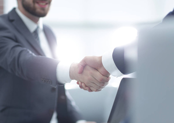 Confident businessman shaking hands - Foto, imagen