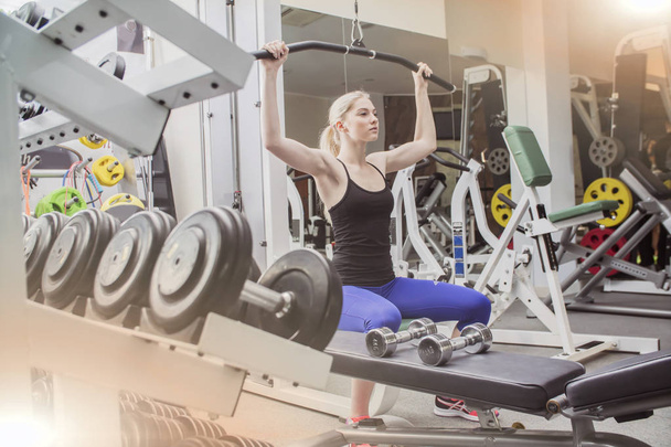 young beautiful blond woman in the gym - Photo, Image