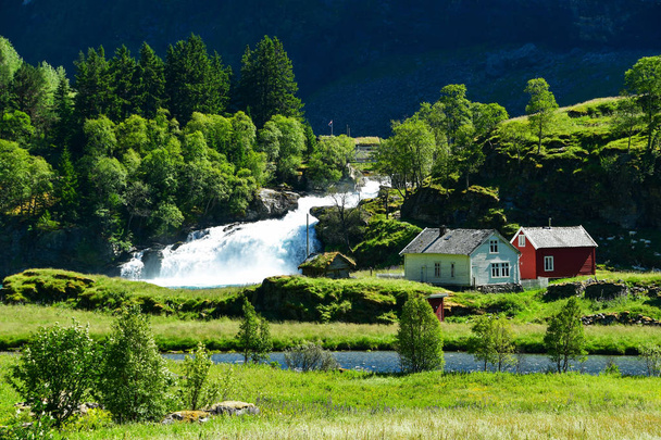 countryside farm with waterfall at flam Norway - Foto, Imagem