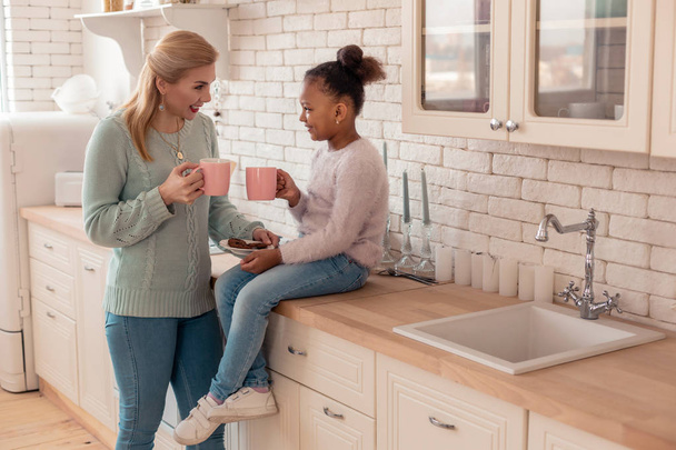 Mother and daughter enjoying weekend spending morning together - Photo, Image