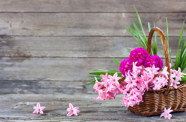 Spring flowers on wooden background - Fotografie, Obrázek