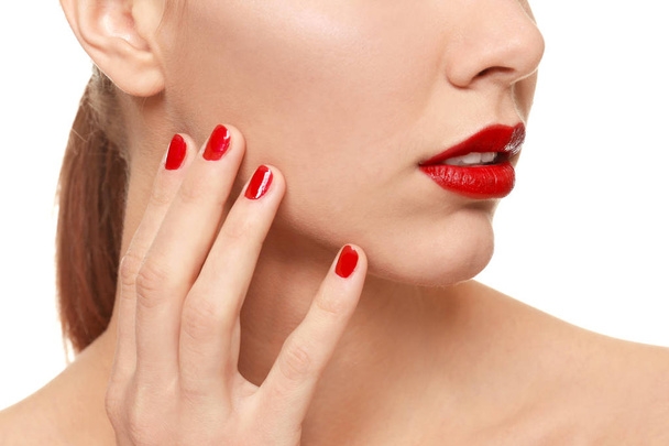 Beautiful young woman with bright lipstick and manicure on white background, closeup - Φωτογραφία, εικόνα