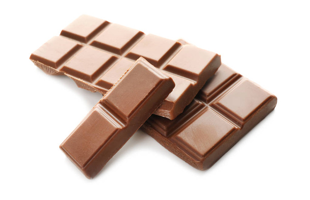 Pieces of milk chocolate on white background - Photo, Image