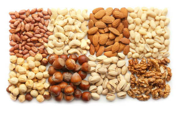 Composition with different types of nuts on white background - Foto, Imagen