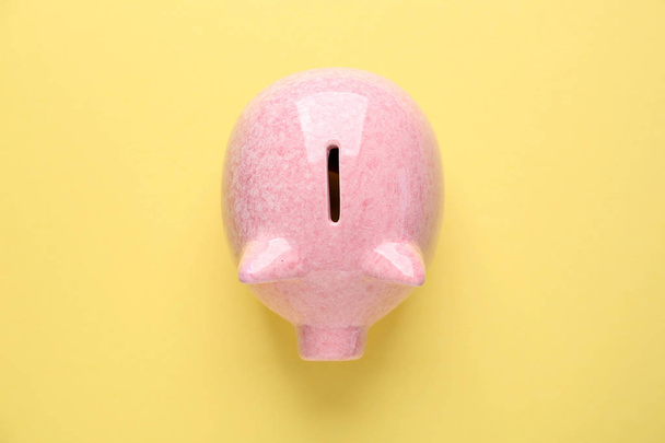 Piggy bank on color background - Valokuva, kuva