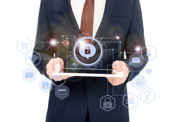 cropped view of businessman holding digital tablet in hands with internet security icons above - Photo, Image