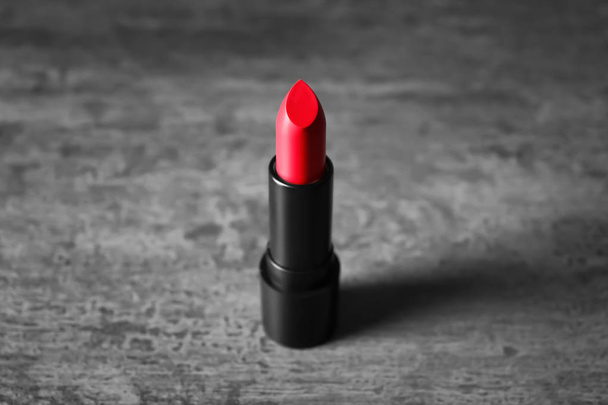 Bright lipstick on grey background - Photo, Image