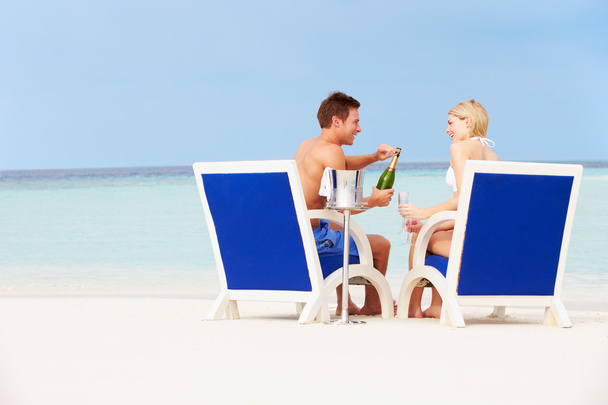 Couple On Beach Relaxing In Chairs And Drinking Champagne - Zdjęcie, obraz
