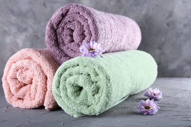 Clean soft towels on grey background - Photo, Image