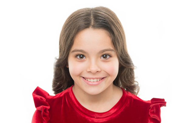 Kid happy cute face with adorable curly hair. Beauty tips for tidy hair. Young skin care. Pure beauty. Kid girl long healthy shiny hair on white background isolated. Little girl with long hair - Foto, Imagen