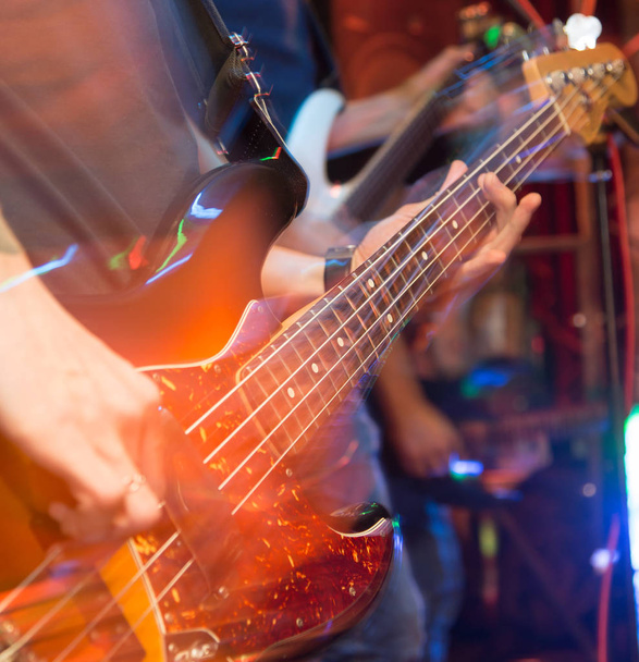 aggressive play guitar on stage - Φωτογραφία, εικόνα