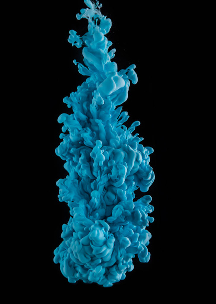 Coloured acrylic ink mixing in water on black - Фото, зображення