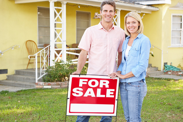 Couple Standing By For Sale Sign Outside Home - Photo, Image
