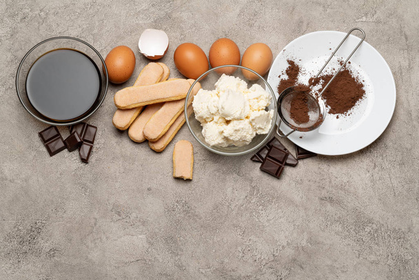Ingredients for cooking tiramisu - Savoiardi biscuit cookies, mascarpone, cream, sugar, cocoa, coffee and egg - Fotó, kép