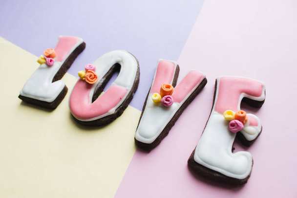 letters cookies with glaze, LOVE lettering of cookies - Фото, изображение