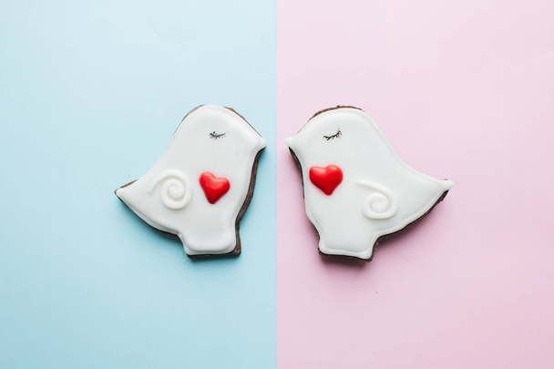 two cookies in heart shape two doves with glaze - Photo, image