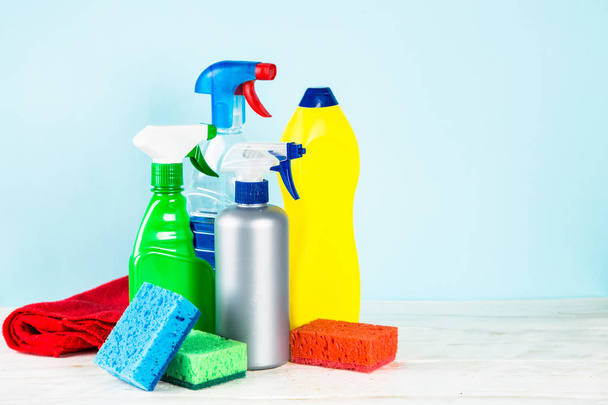 Cleaning product, household on blue background. - Foto, imagen