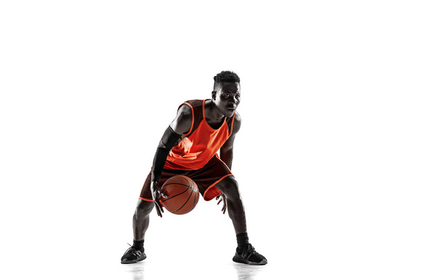 Full length portrait of a basketball player with ball - Foto, imagen