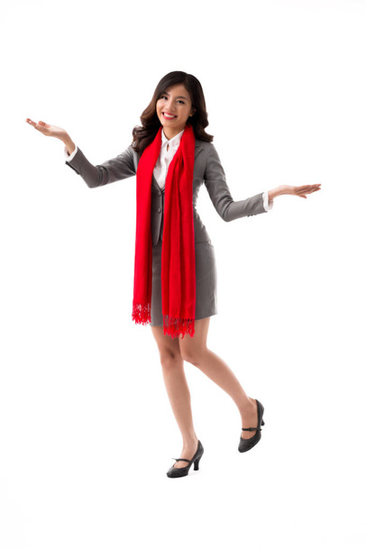 Happy pretty Asian businesswoman with long red scarf, isolated on white - Fotó, kép