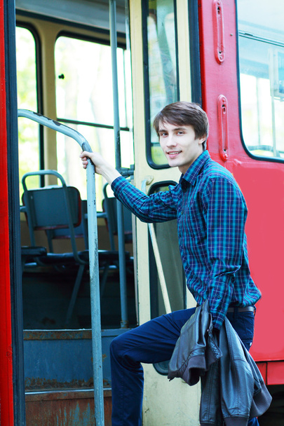 man going to enter the city tram - Foto, Bild