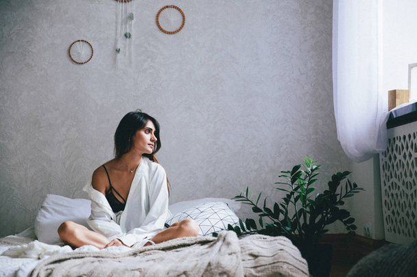 young woman resting on bed at home - 写真・画像