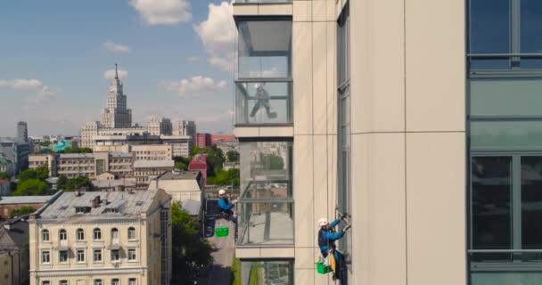 Window Washers on a Office Building. Industrial climber - Facade Cleaning. Aerial photography air drone - Footage, Video