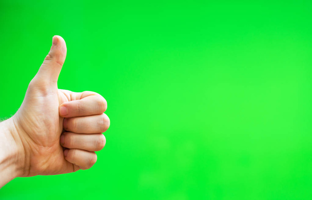 Male hand showing thumbs up. Chroma key. Place for your advertisement. - Photo, Image