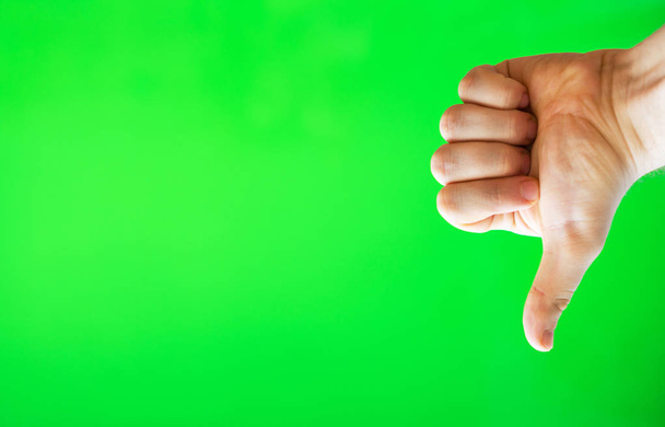 Male hand showing thumbs down. Chroma key. Place for your advertisement. - Photo, Image