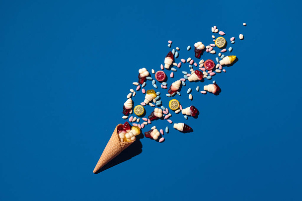 An image of a heap of jelly bean that is sprinkled from a waffle cone - Photo, Image