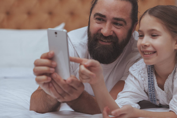Father and daughter enjoying cozy day at home - Photo, Image