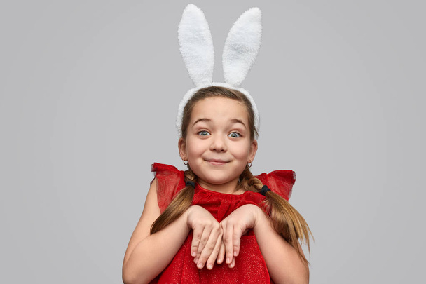 Cute girl in white ears posing as bunny  - Fotografie, Obrázek
