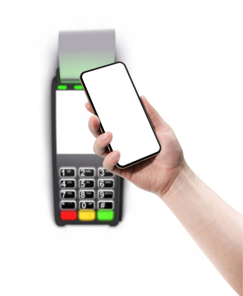 Terminal płatności i smartphone w ręku izolowane na białym tle. - Zdjęcie, obraz