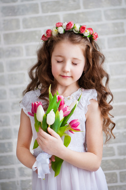 Beautiful girl with tulips - Фото, зображення