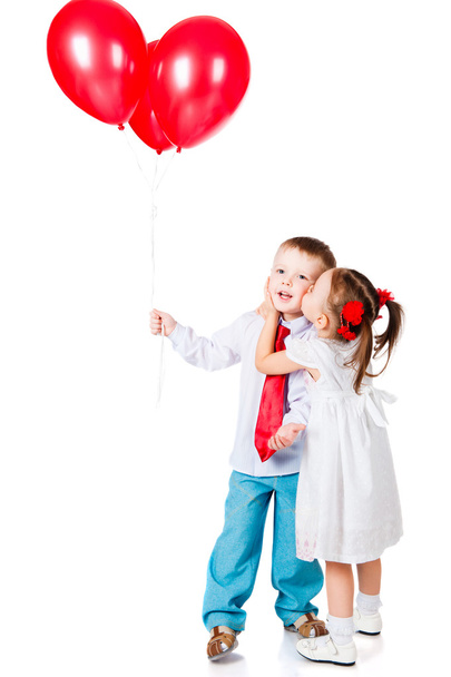 Boy and girl with the red balloons - Foto, afbeelding