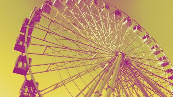 Ferris wheel. High carousel on a yellow background - Footage, Video