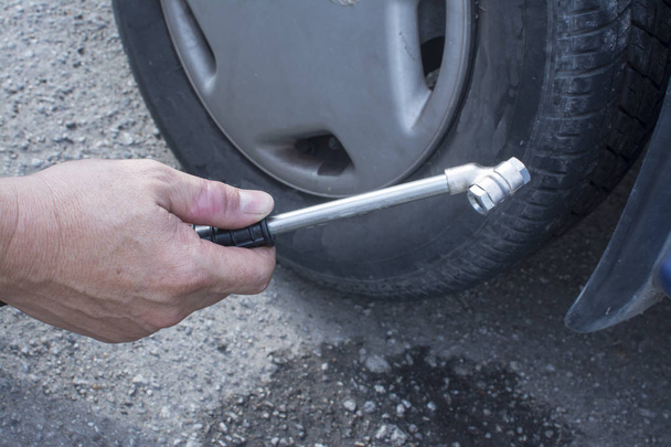 iron nozzle filling up car tyre air - Photo, Image